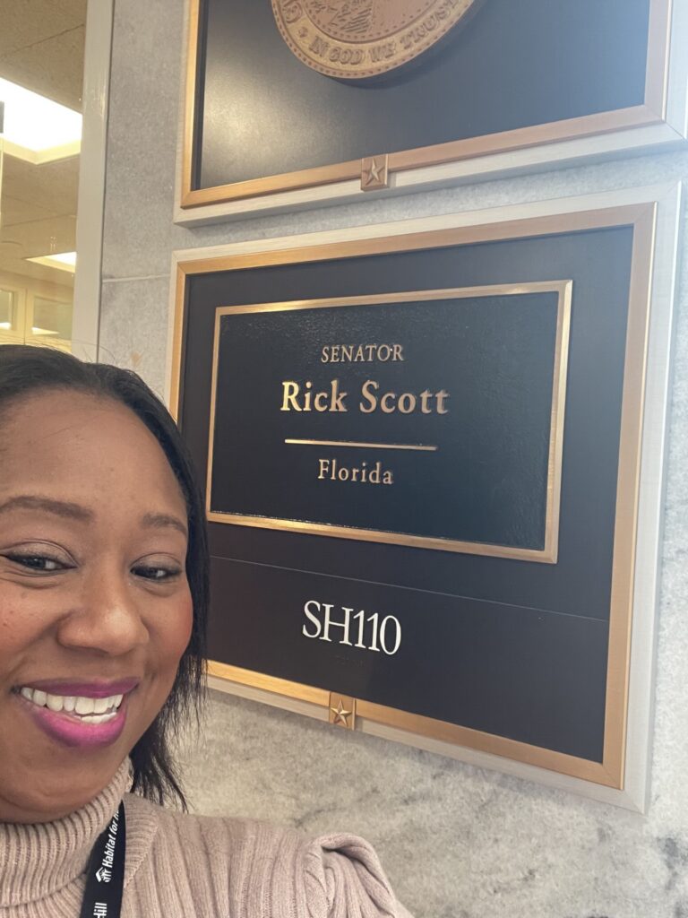 Tiffany in front of Sen. Rick Scott sign
